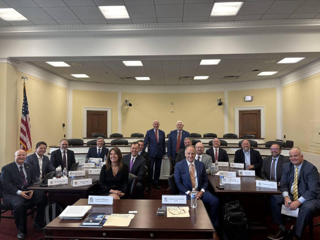 Photo of ISA Board Members meeting with Representative Pete Sessions, R-TX in House Oversight Committee Room (seated at tables)